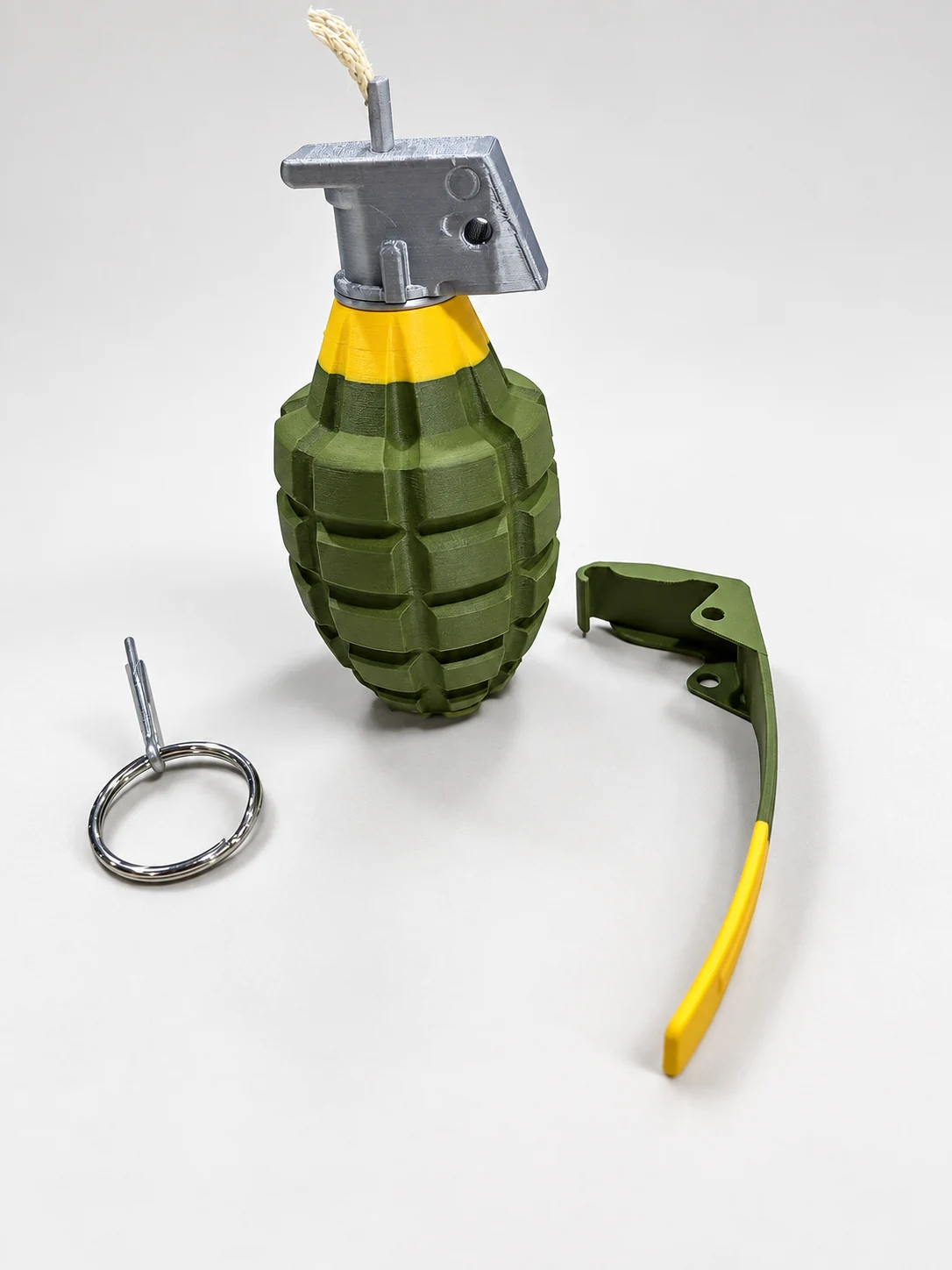 Grenade novelty model with spoon and ring removed