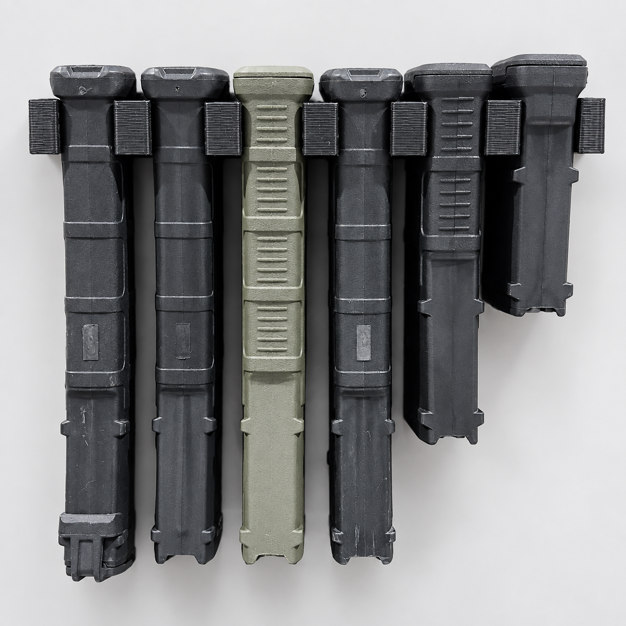 Six PMAGs displayed in separate black individual wall mounts on a clean background