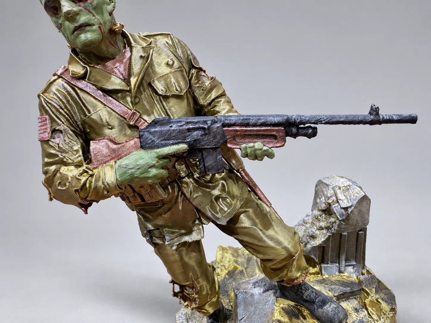 Close-up of the sculpted BAR rifle and hands