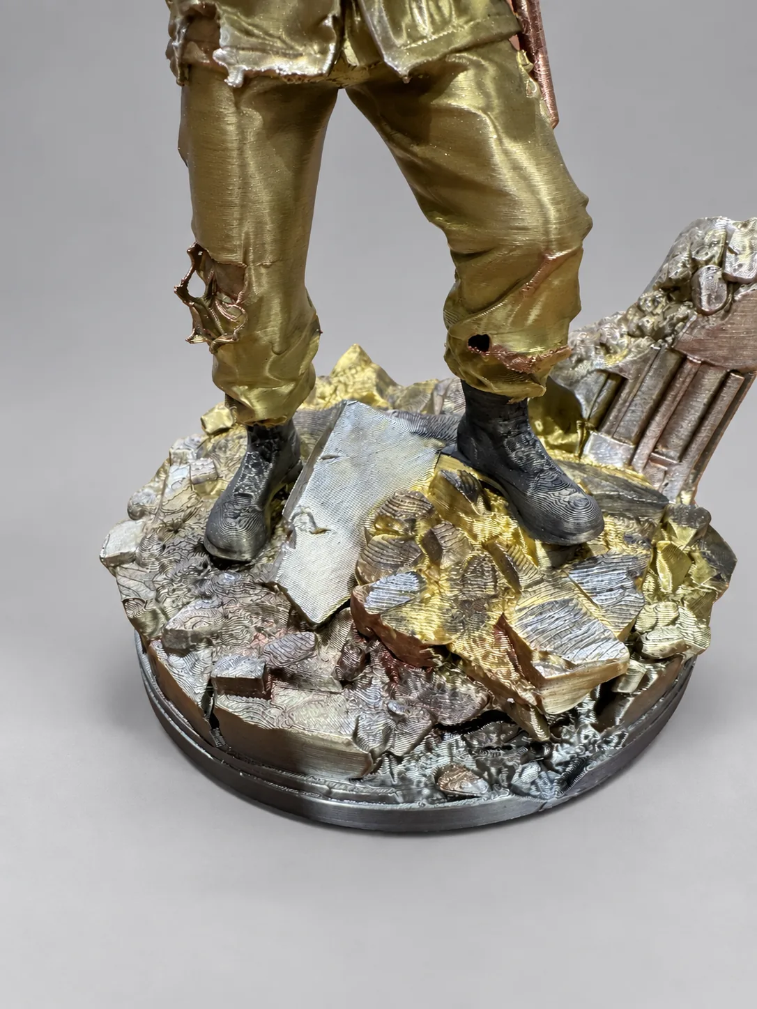 Close-up of boots and rubble display base
